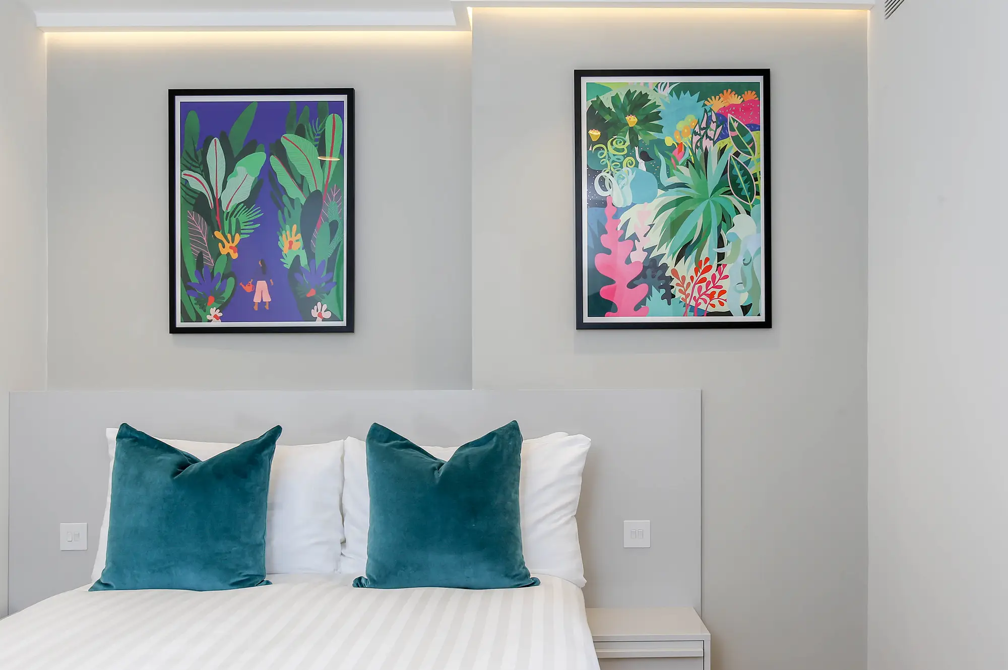 A cozy sleeping area and wardrobe space in a studio apartment at Cromwell serviced apartments, 3 Knaresborough Place, Kensington, London