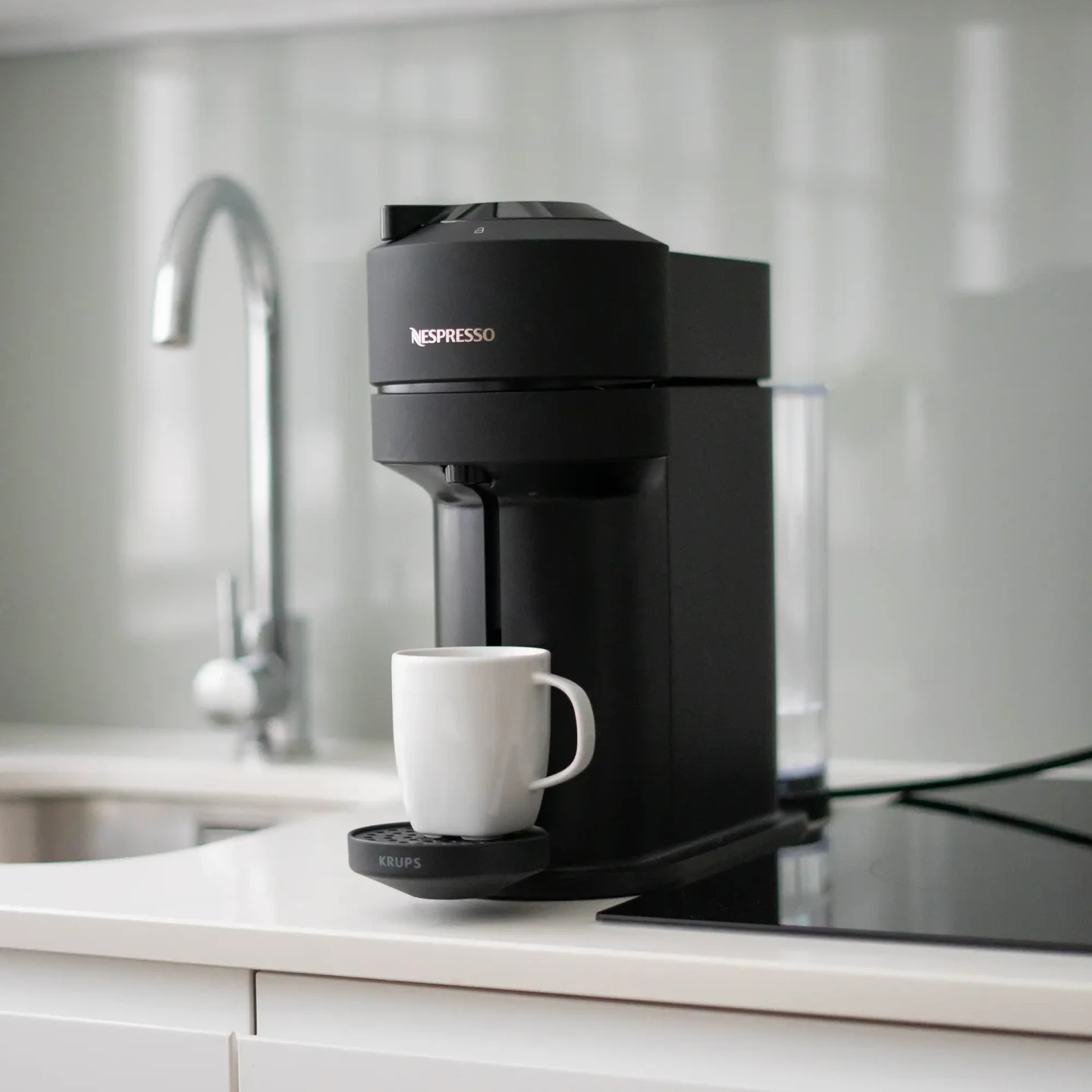 A stylish Nespresso coffee machine in a fully equipped kitchenette at Stayprime serviced apartment