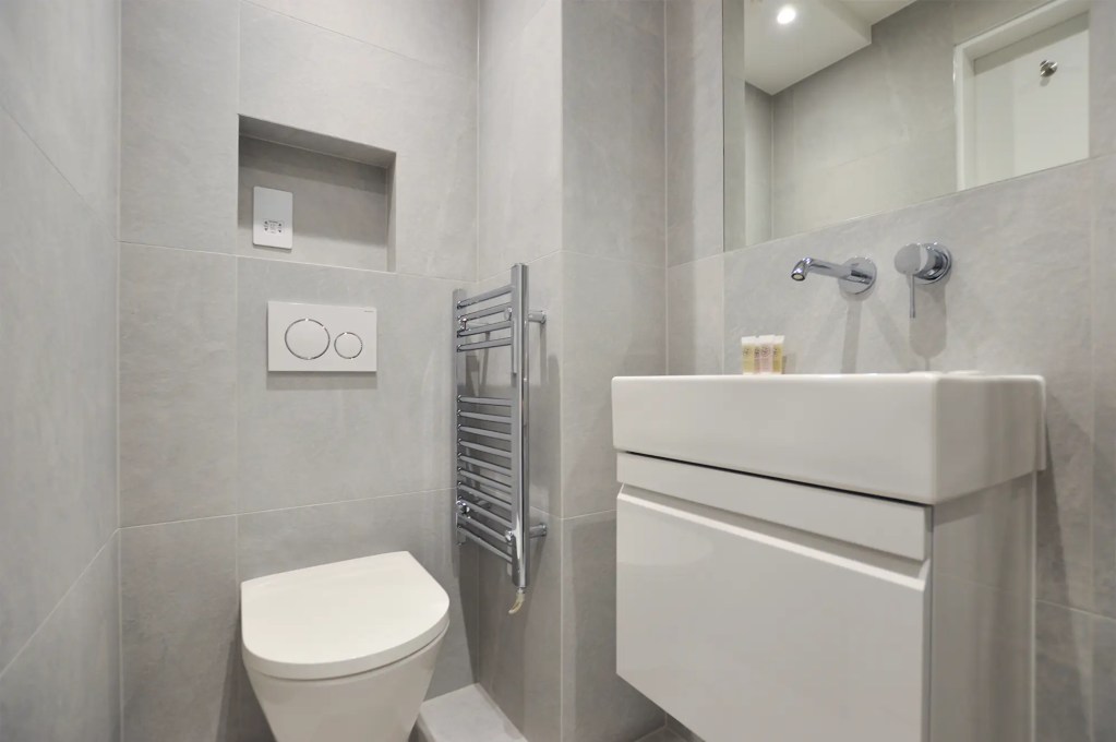 Stylish double bed in a large lower ground studio in Marylebone at 162 New Cavendish, London.