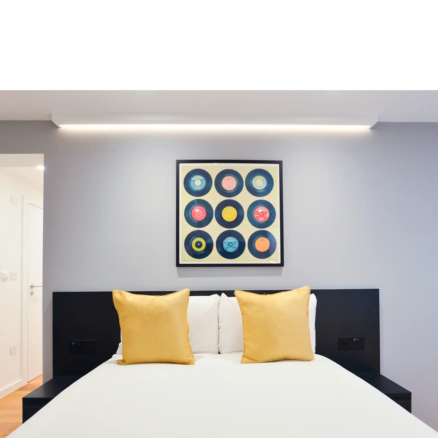 Stylish double bed in a large lower ground studio in Marylebone at 162 New Cavendish, London.