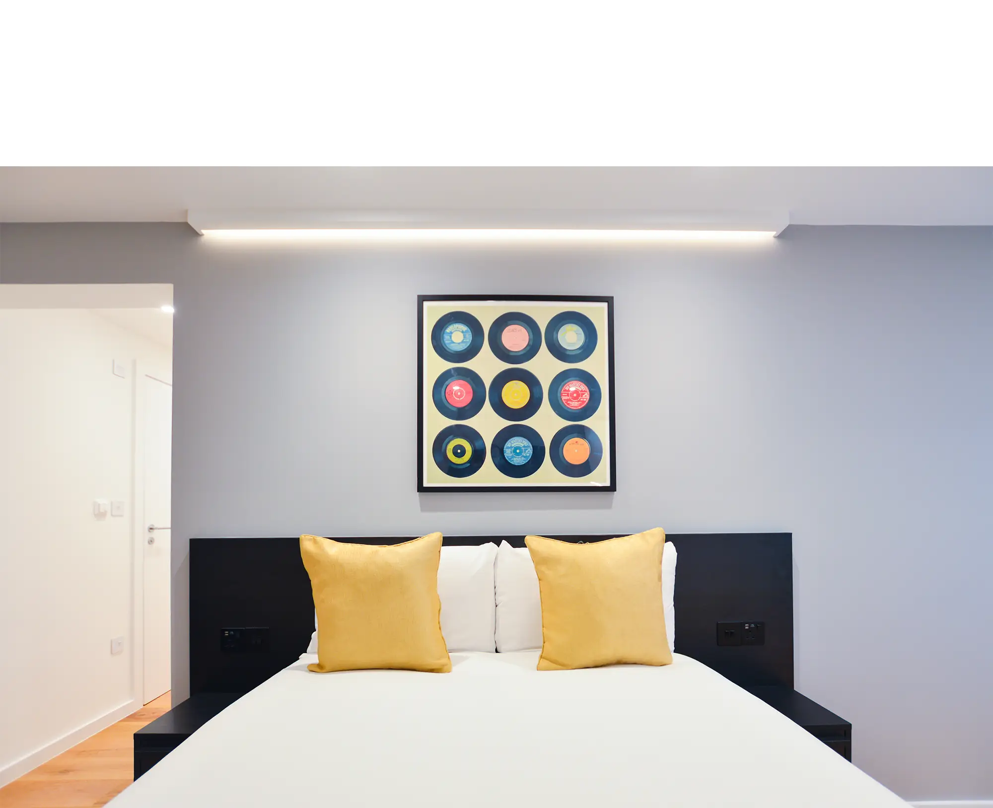 Stylish double bed in a large lower ground studio in Marylebone at 162 New Cavendish, London.