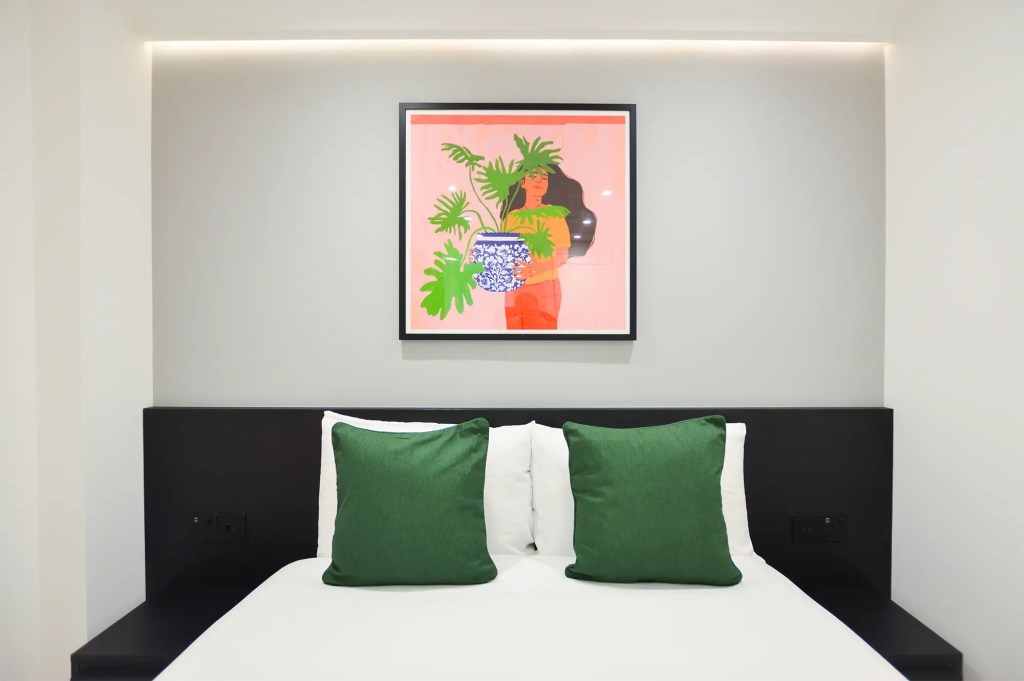 Chic double bed in a stylish lower ground studio in Marylebone at 162 New Cavendish, London, near the BT Tower