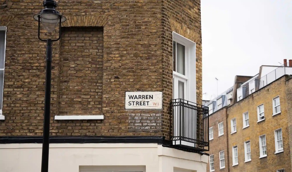 Street sign indicating Warren Street in the Fitzrovia district of London