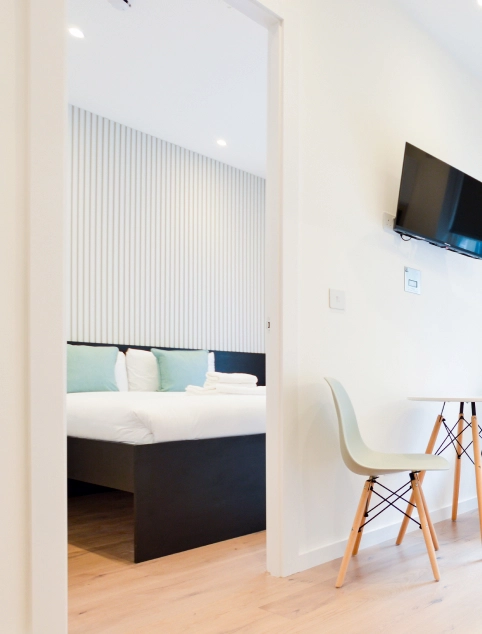 A modern one bedroom long term let apartment in central London with a separate sleeping area and dining area