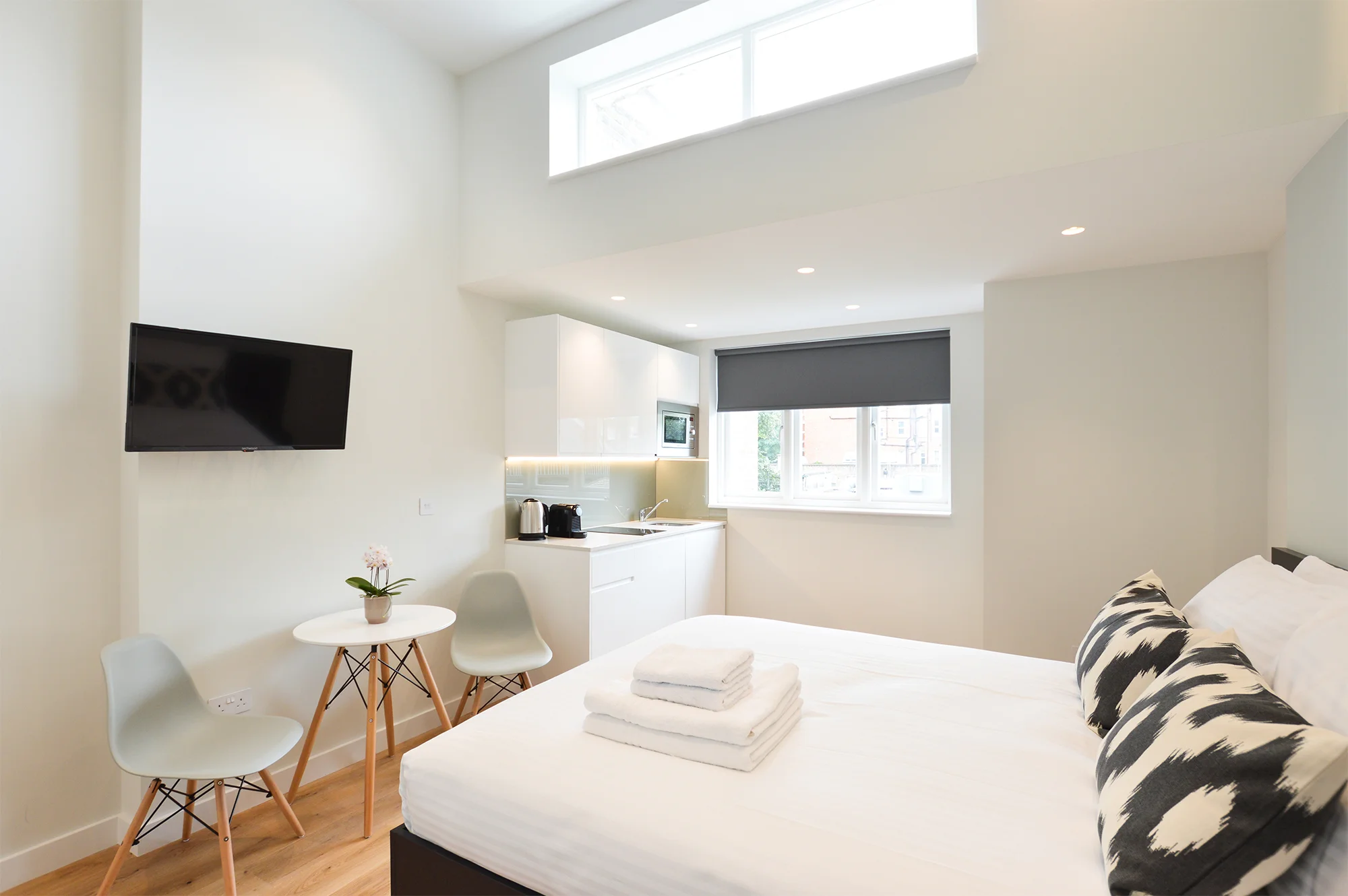 Modern serviced apartment in Earls Court with high ceilings, wooden floors, and abundant natural light