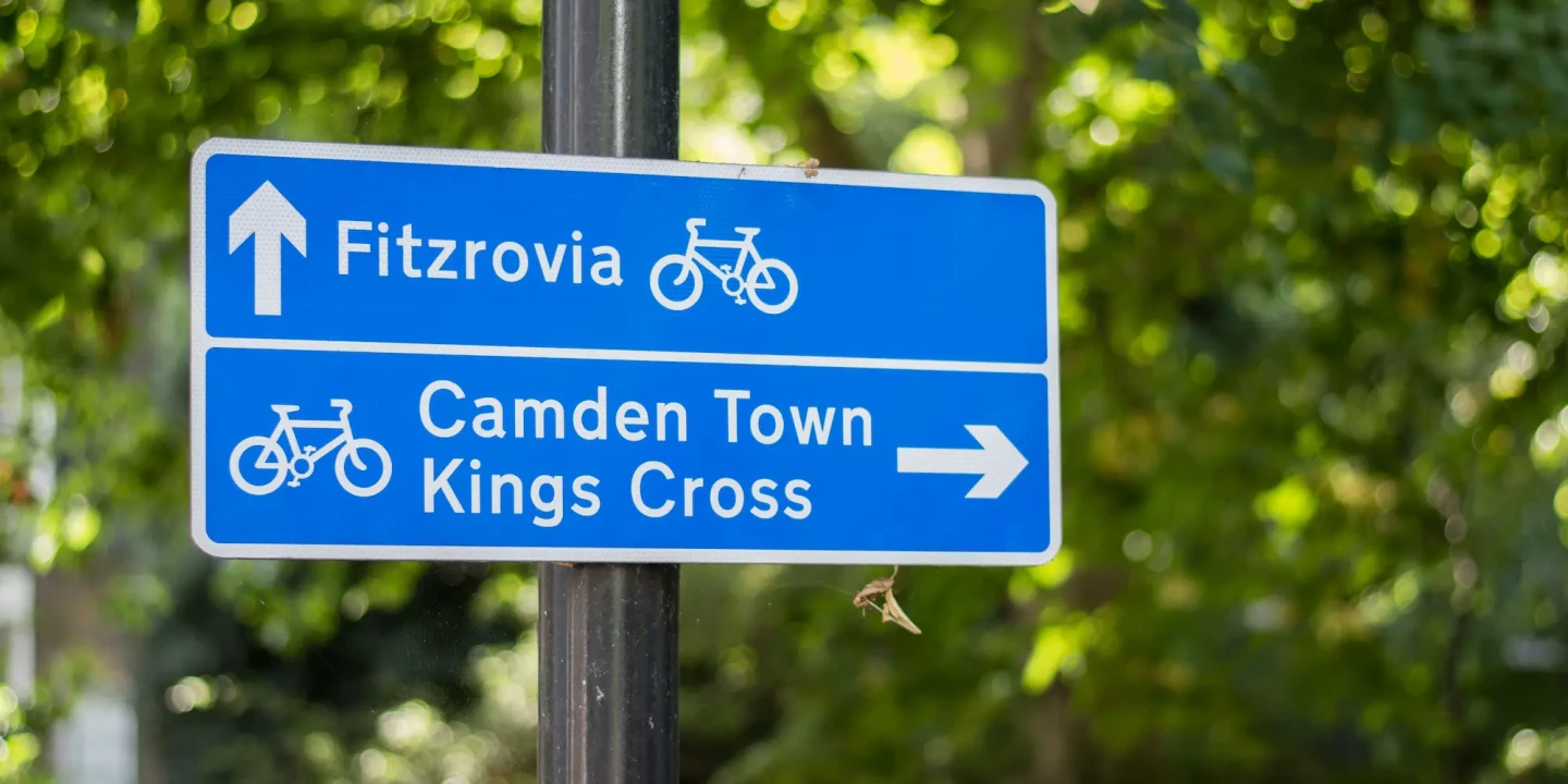 Fitzrovia street sign pointing toward the neighborhood near Fitzrovia Serviced Apartments, close to cafés, restaurants, and hidden gems in central London